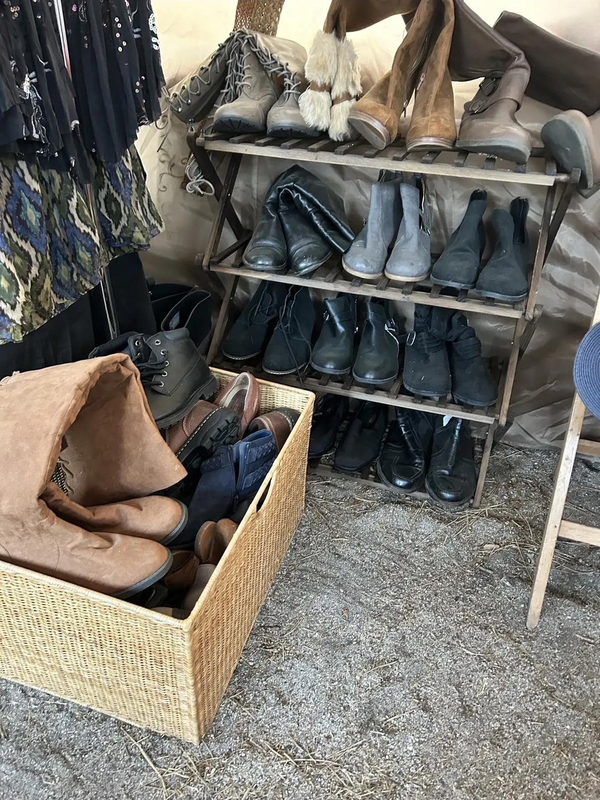 Boots and shoes stacked on shelves and in a woven basket