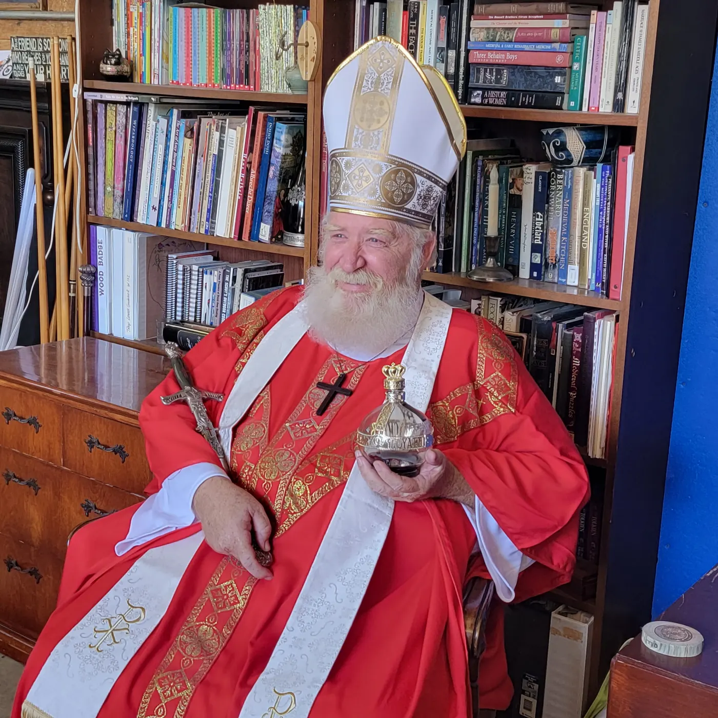 St. Nicholas seated with a sword and a jeweled goblet among bookshelves