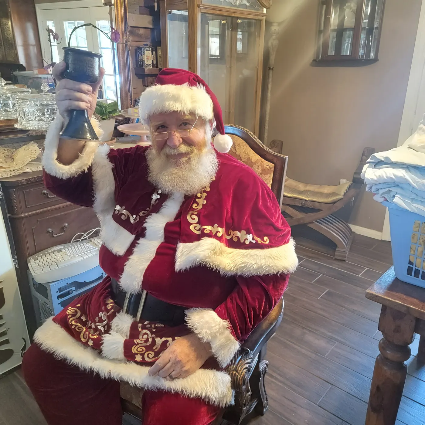 Father Christmas raising a goblet in a toast